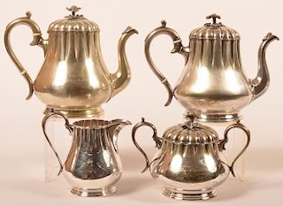 Good four piece “Lodge” nickel on copper tea set with floral finials