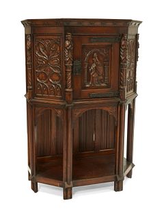 A Gothic Revival carved wood court cupboard