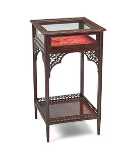 A carved mahogany table vitrine