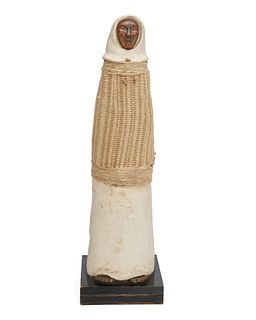 A ceramic, bronze, and fiber figural sculpture