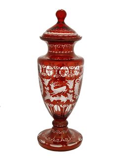 A Bohemian cut-glass lidded vase