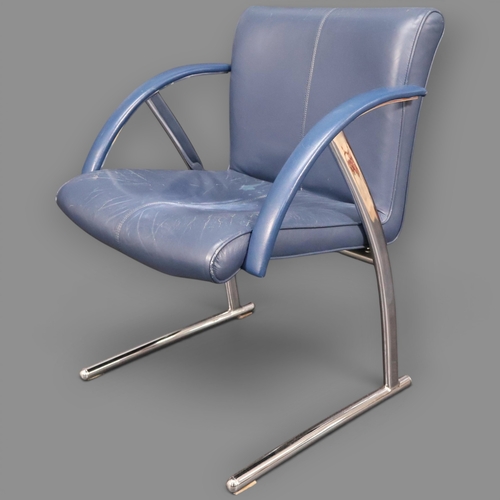 A contemporary faux-leather upholstered …